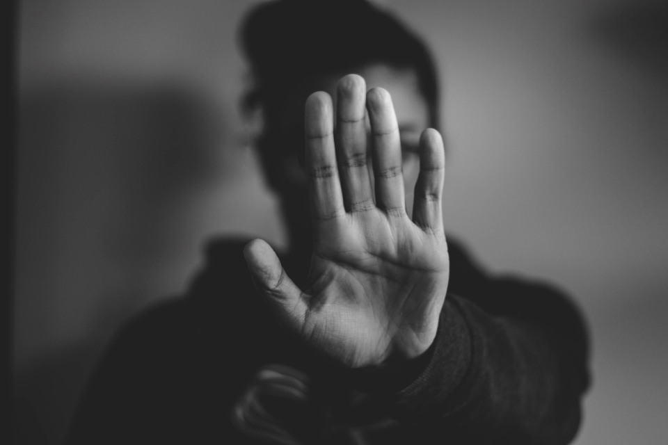 Person holding up a hand as if to say 'stop', by Nadine Shaabana from Unsplash.com